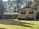 Lovely two-story home with brick facade, a well-manicured lawn, and an inviting front entrance at 3530 Embry Cir, Atlanta, GA 30341