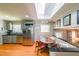 Eat-in kitchen with stainless steel appliances, skylight, and a cozy dining area at 3530 Embry Cir, Atlanta, GA 30341