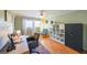 Bright home office with hardwood floors, large windows, a ceiling fan, and a large gray security safe at 3530 Embry Cir, Atlanta, GA 30341