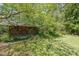 Rustic shed nestled amidst greenery in the backyard at 3530 Embry Cir, Atlanta, GA 30341