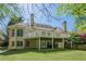 Back exterior featuring a dual-level deck and well-maintained lawn at 370 Royal Birkdale Ct, Johns Creek, GA 30097