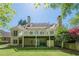 Expansive back exterior featuring a dual-level deck and well-maintained lawn at 370 Royal Birkdale Ct, Johns Creek, GA 30097