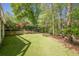 Large backyard with lush greenery, perfect for outdoor activities at 370 Royal Birkdale Ct, Johns Creek, GA 30097