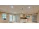Finished basement with a small kitchenette, drop ceiling, window and tile floor at 370 Royal Birkdale Ct, Johns Creek, GA 30097