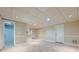 Finished basement featuring tile flooring, drop ceiling, and access to a bathroom at 370 Royal Birkdale Ct, Johns Creek, GA 30097