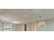 Finished basement with recessed lighting, tile floor, wall mirrors and basement windows at 370 Royal Birkdale Ct, Johns Creek, GA 30097