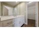 Bathroom features white vanity, and walk-in closet with wire shelving at 370 Royal Birkdale Ct, Johns Creek, GA 30097
