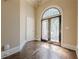 Inviting foyer featuring hardwood floors, a decorative double door, and neutral color scheme at 370 Royal Birkdale Ct, Johns Creek, GA 30097