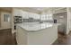 Kitchen features white cabinets and stainless steel appliances at 370 Royal Birkdale Ct, Johns Creek, GA 30097
