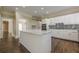 Spacious kitchen with a center island, white cabinets, and modern appliances at 370 Royal Birkdale Ct, Johns Creek, GA 30097