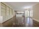 Bright and open living space with hardwood floors and built-in cabinets and shelving at 370 Royal Birkdale Ct, Johns Creek, GA 30097
