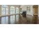 Sun-lit living room showcasing a fireplace and built-in shelves at 370 Royal Birkdale Ct, Johns Creek, GA 30097