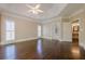 Light and airy main bedroom boasts hardwood floors and a door to the spa-like bathroom at 370 Royal Birkdale Ct, Johns Creek, GA 30097
