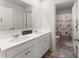 Bathroom with tiled floors, double vanity sinks, and a separate toilet with a curtained shower, designed for relaxation at 4823 Layton Dr, Lithia Springs, GA 30122
