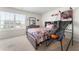 Bright bedroom with a basketball theme, featuring a sports-themed bedspread and ample natural light at 4823 Layton Dr, Lithia Springs, GA 30122