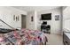 Cozy bedroom featuring a sports-themed bedspread, a workstation, and ample natural light at 4823 Layton Dr, Lithia Springs, GA 30122