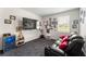 Bonus room with sports decor, mini fridge, and plush seating for a relaxed hangout space at 4823 Layton Dr, Lithia Springs, GA 30122