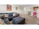 Cozy bonus room features a comfortable sectional sofa with fun movie decor and a popcorn machine at 4823 Layton Dr, Lithia Springs, GA 30122