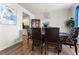 Formal dining room with decorative chandelier, wood flooring, and space for entertaining and dining at 4823 Layton Dr, Lithia Springs, GA 30122
