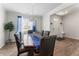 Dining room with ample lighting, wood flooring, and views of the front door and foyer at 4823 Layton Dr, Lithia Springs, GA 30122