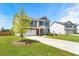Well-manicured lawn complements this lovely home with a long driveway leading to a two-car garage at 4823 Layton Dr, Lithia Springs, GA 30122