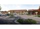 Commercial complex featuring a parking lot, restaurants, and red brick professional buildings at 4823 Layton Dr, Lithia Springs, GA 30122