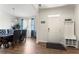 Bright foyer with dining room view and a convenient coat rack for guests at 4823 Layton Dr, Lithia Springs, GA 30122