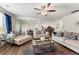 Spacious living room showcasing an open floor plan with hardwood floors and seamless flow to the kitchen at 4823 Layton Dr, Lithia Springs, GA 30122