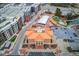 Aerial view of a city hall with a clock tower, surrounded by parking and green spaces at 5036 Maplecliff Dr, Sugar Hill, GA 30518