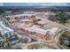 Aerial view of a town center featuring shopping, entertainment, and dining options at 5036 Maplecliff Dr, Sugar Hill, GA 30518