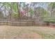 Fenced backyard featuring a lawn, providing privacy and outdoor space at 5036 Maplecliff Dr, Sugar Hill, GA 30518