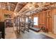 Spacious unfinished basement, with workout equipment, offering plenty of storage and customization options at 5036 Maplecliff Dr, Sugar Hill, GA 30518