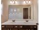 Bathroom featuring double sink vanity, white countertop, and modern lighting fixtures at 5036 Maplecliff Dr, Sugar Hill, GA 30518