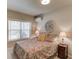 Relaxing bedroom features a comfortable bed, decorative pillows, a window, and neutral wall color at 5036 Maplecliff Dr, Sugar Hill, GA 30518
