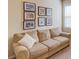 Bedroom with a comfortable couch, framed artwork, and natural lighting at 5036 Maplecliff Dr, Sugar Hill, GA 30518