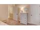Bedroom featuring neutral colored walls, carpet flooring, and white doors and trim at 5036 Maplecliff Dr, Sugar Hill, GA 30518