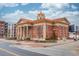 City of Sugar Hill, Georgia, City Hall exterior featuring a red-brick facade, columns, and a clock tower at 5036 Maplecliff Dr, Sugar Hill, GA 30518