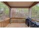 Outdoor deck area featuring a grill with a view of the surrounding greenery at 5036 Maplecliff Dr, Sugar Hill, GA 30518