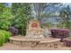 Stone monument for the community entrance surrounded by beautiful landscaping at 5036 Maplecliff Dr, Sugar Hill, GA 30518
