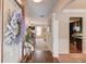 Open foyer showcasing hardwood floors, staircase, and views into the living room and kitchen at 5036 Maplecliff Dr, Sugar Hill, GA 30518