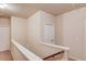 Upper hallway featuring neutral walls, white trim, and access to multiple rooms at 5036 Maplecliff Dr, Sugar Hill, GA 30518