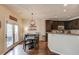 Bright kitchen and breakfast nook, complete with modern appliances, dark cabinetry, and access to outdoor area at 5036 Maplecliff Dr, Sugar Hill, GA 30518