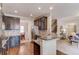 Well-equipped kitchen features granite countertops, stainless steel appliances, and dark cabinetry at 5036 Maplecliff Dr, Sugar Hill, GA 30518