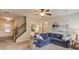 Bright living room with neutral colors, a staircase, and cozy furniture at 5036 Maplecliff Dr, Sugar Hill, GA 30518