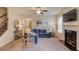 Inviting living area with fireplace, mounted TV, and a comfortable seating arrangement at 5036 Maplecliff Dr, Sugar Hill, GA 30518