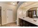 Spacious main bathroom featuring double sink vanity, tile floors, soaking tub and glass enclosed shower at 5036 Maplecliff Dr, Sugar Hill, GA 30518