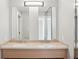 Elegant bathroom with double sinks, vanity, and large mirrors, creating a stylish and functional space at 250 Park Avenue West Nw # 313, Atlanta, GA 30313