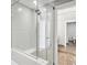 Modern bathroom with glass-enclosed shower and rainfall showerhead, offering a spa-like experience at 250 Park Avenue West Nw # 313, Atlanta, GA 30313