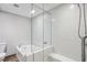 Modern bathroom with a soaking tub, separate shower, and sleek fixtures, creating a spa-like experience at 250 Park Avenue West Nw # 313, Atlanta, GA 30313
