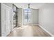 Bright bedroom featuring hardwood floors, large windows, and a ceiling fan, creating a comfortable and inviting atmosphere at 250 Park Avenue West Nw # 313, Atlanta, GA 30313